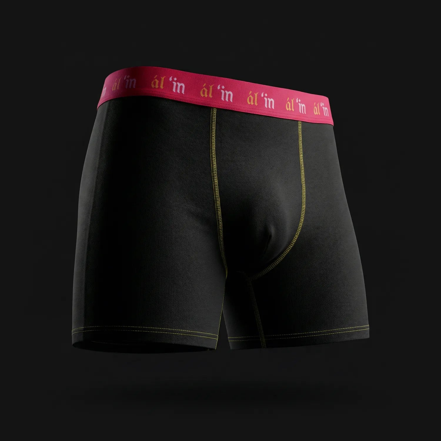 Black boxer briefs with a red waistband on a black background